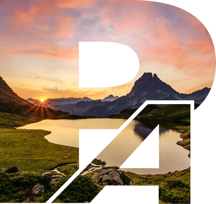 Coucher de soleil sur les Pyrénées masqué par la forme du logo de Pyrénées Automatismes